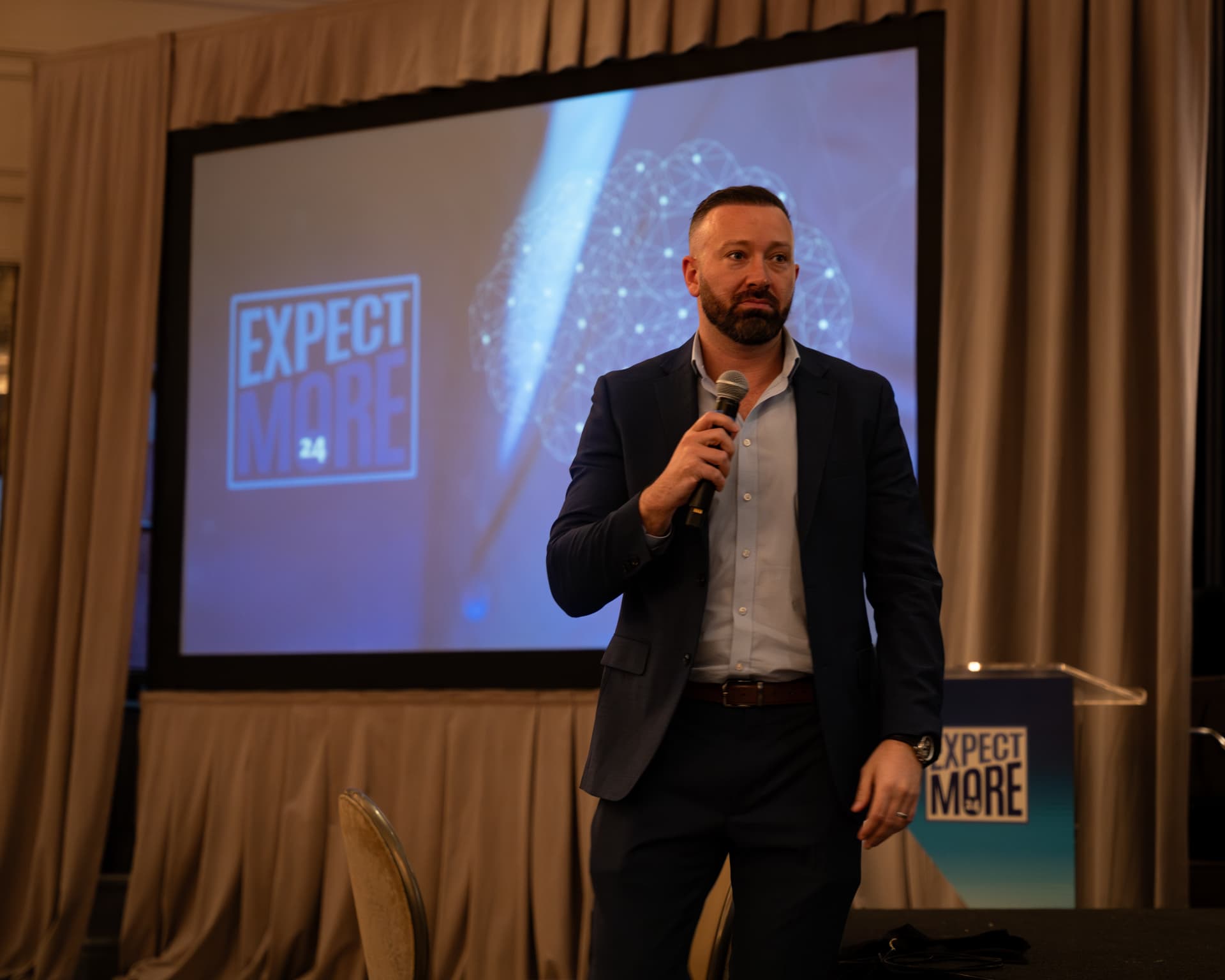 A ZG leader speaking at the Expect More conference