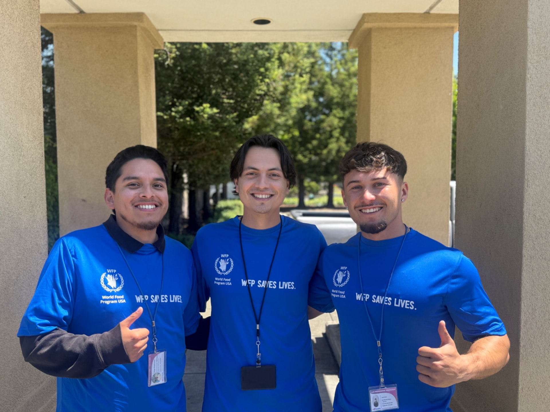Three ZG representatives in World Food Program shirts before a shift